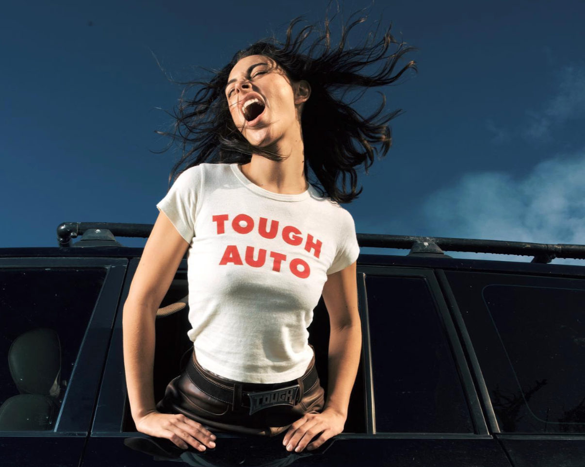 Image of girl in Tough Auto T shirt and Leather skirt 