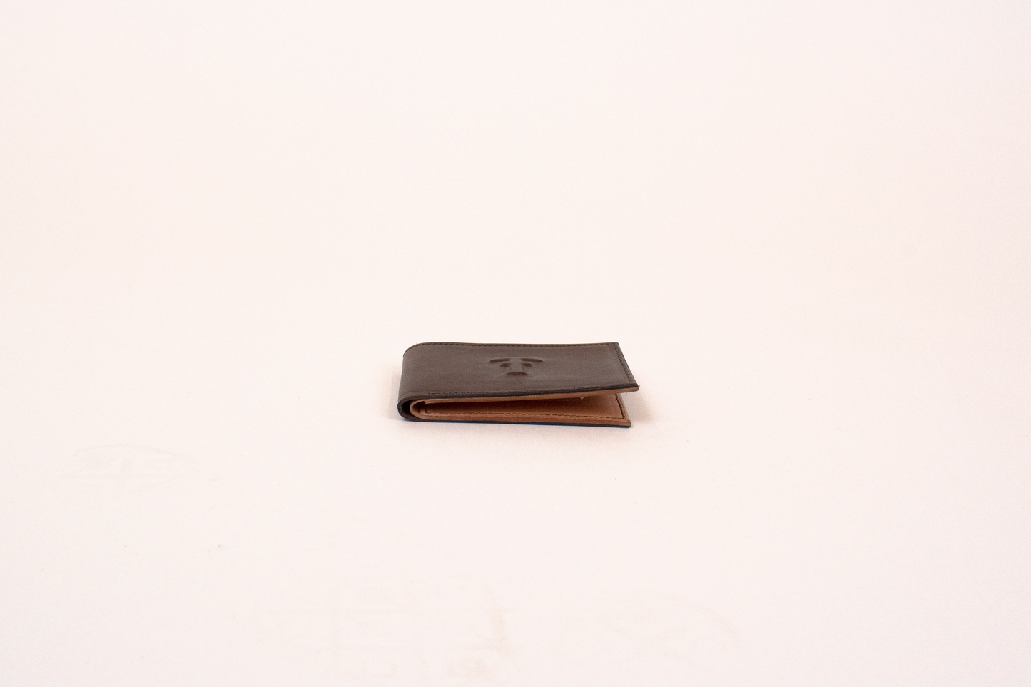 Brown leather wallet on a white background