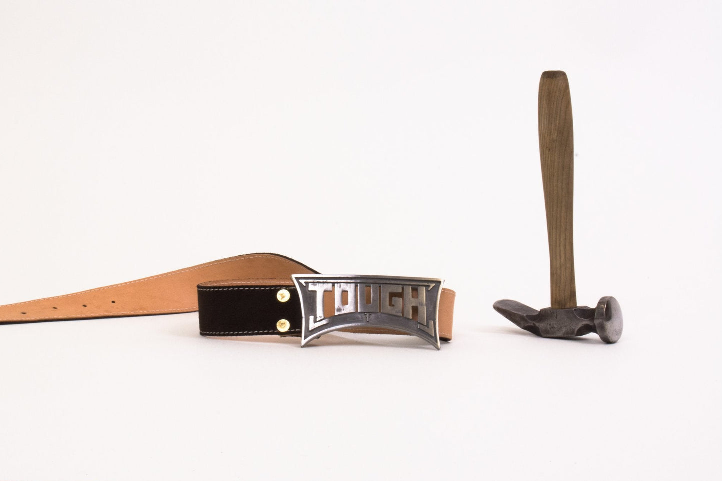 Belt with a prominent buckle and a hammer on a white background