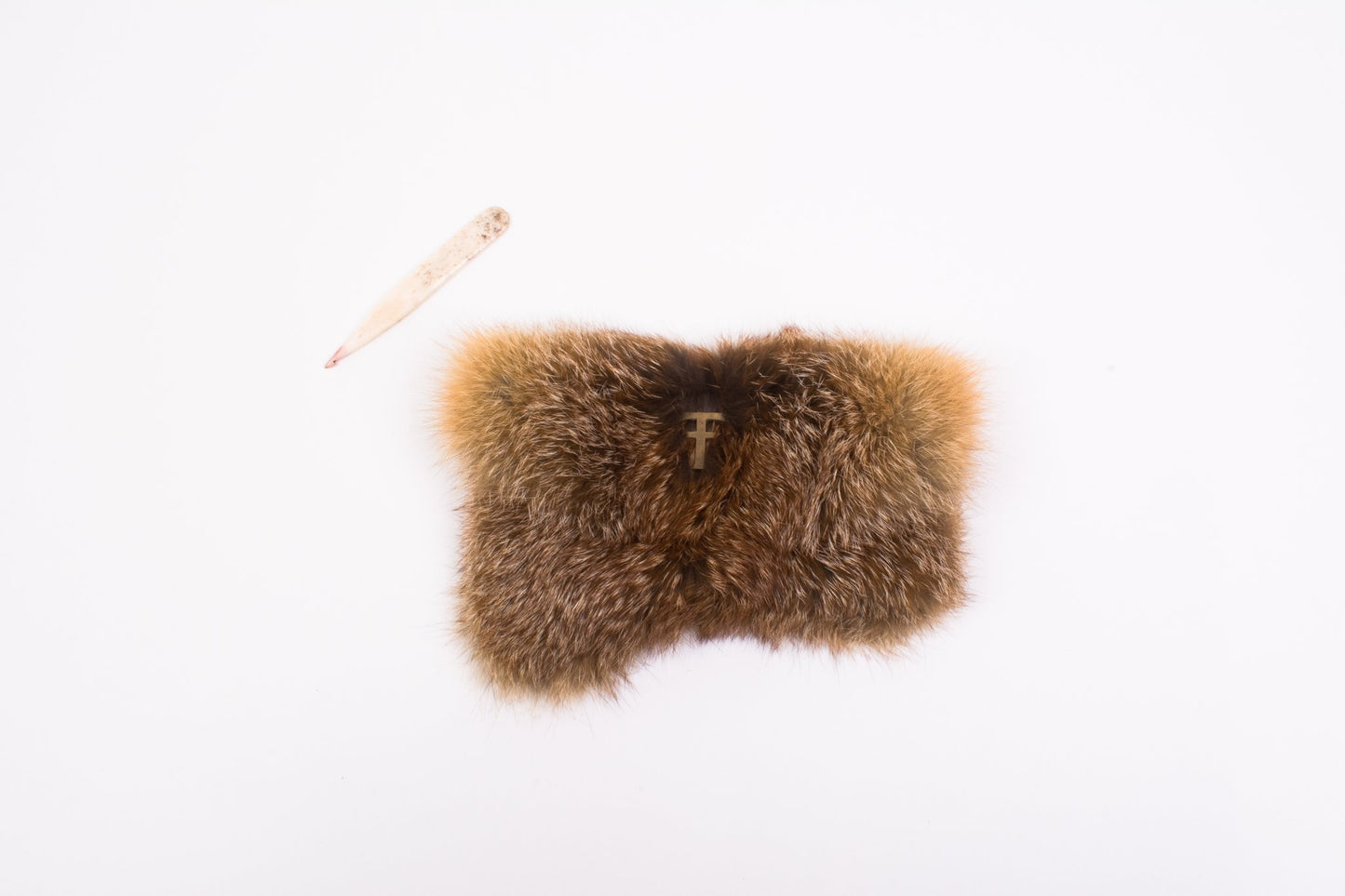 Brown fur purse  with a Bronze Tough Auto logo on a white background